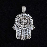 white beaded hamsa pendant